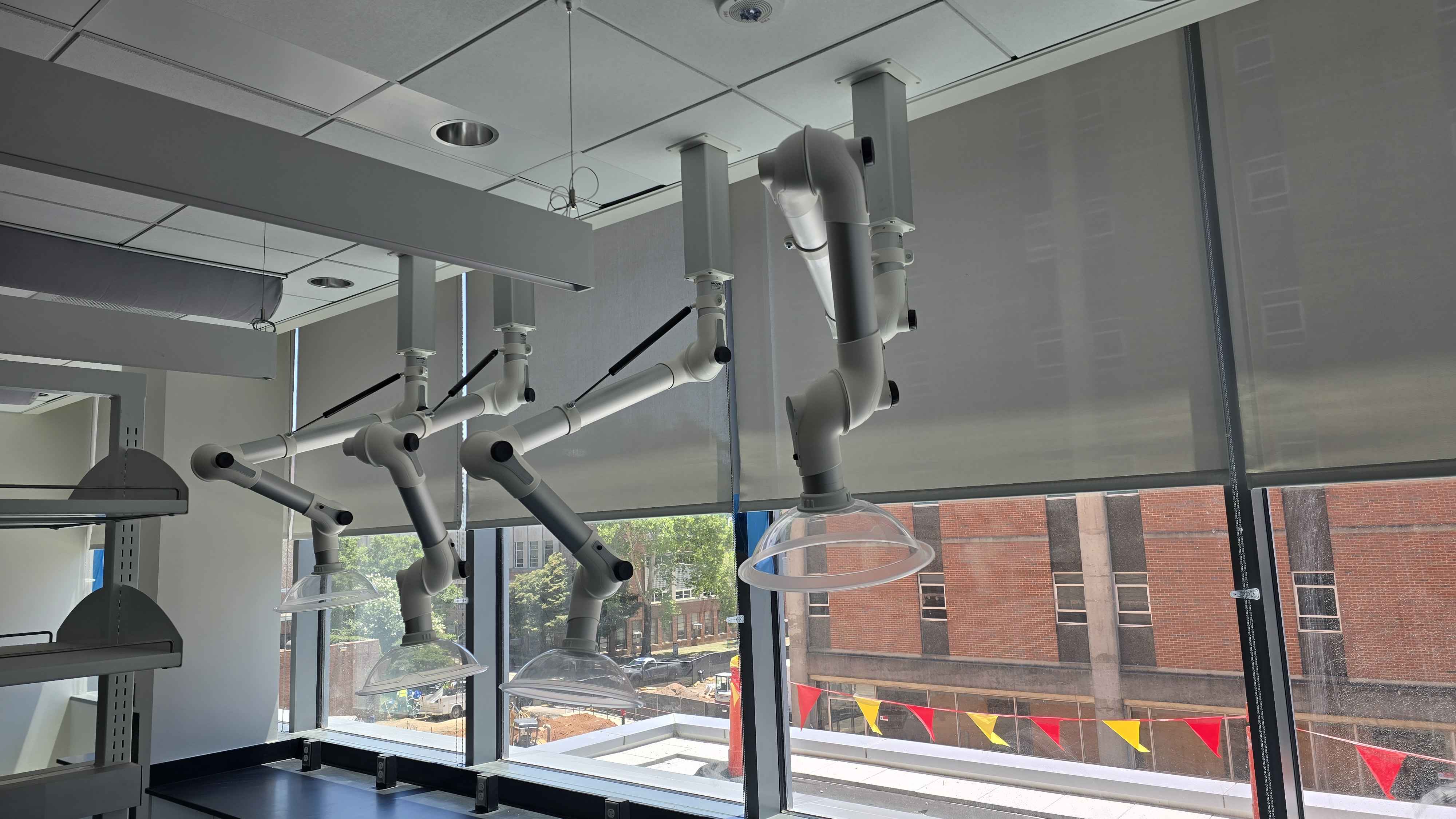 Grey roller shades installed in a commercial laboratory fit-out